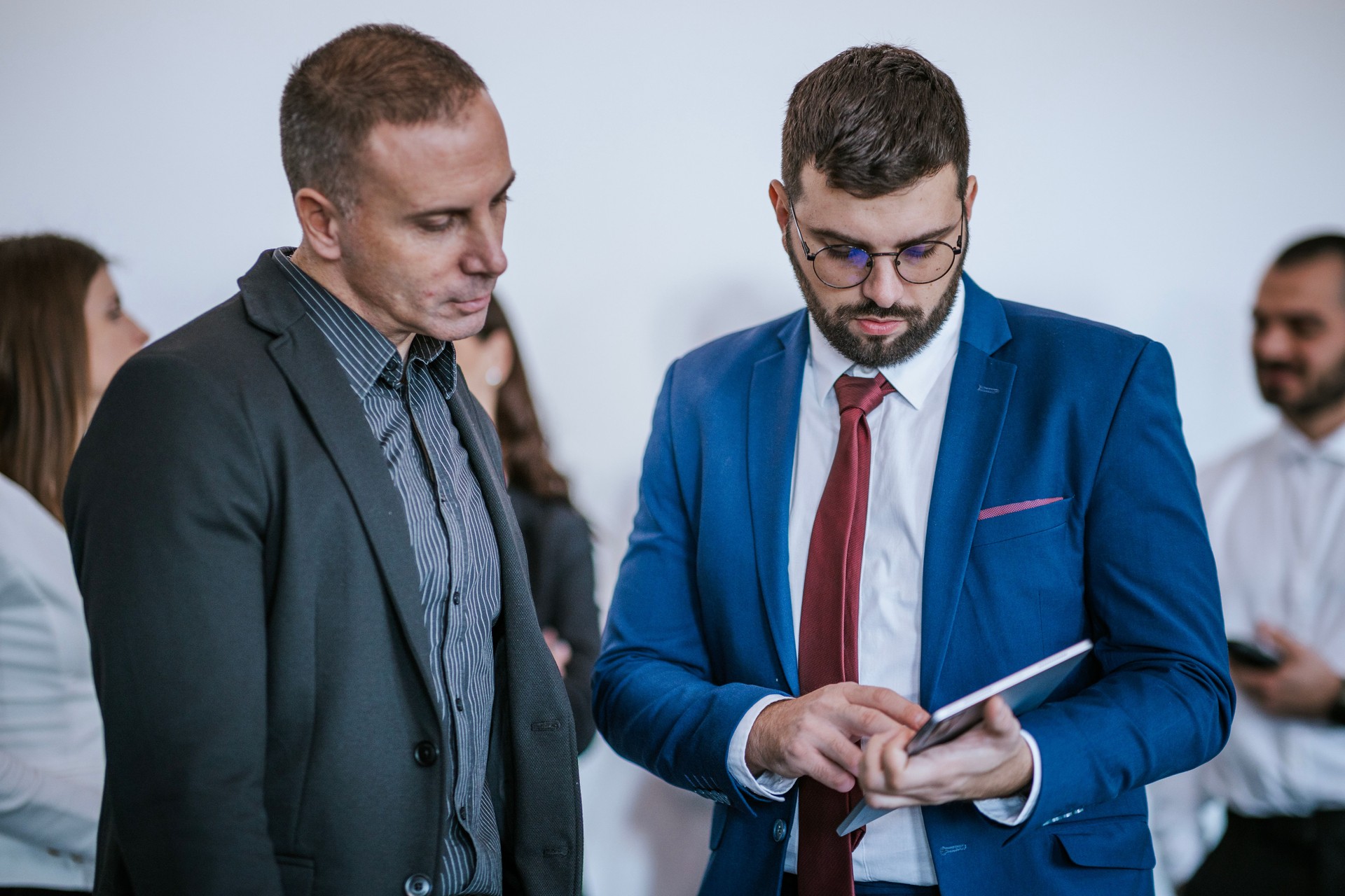Professionals engaging in conversation during a business meeting or seminar